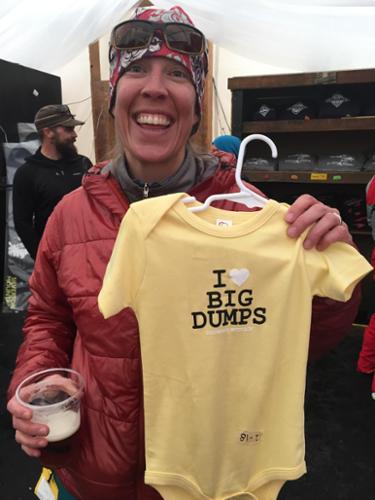 A woman holds up a T-shirt that says, "I heart big dumps."
